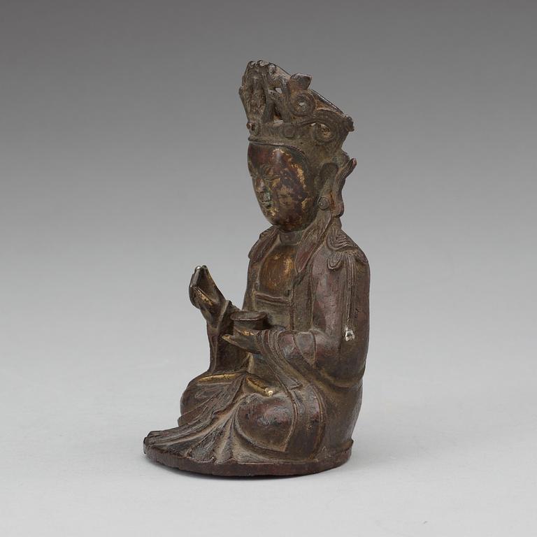A bronze figure of a seated Guanyin, Ming dynasty.