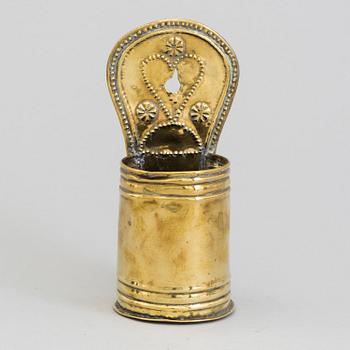 A 19TH CENTURY BRASS SPOON HOLDER.