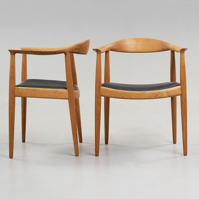 A pair of Hans J Wegner's oak 'The Chair' by Johannes Hansen, Copenhagen.