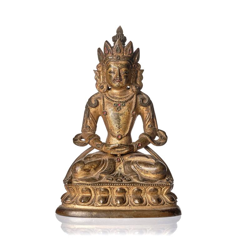 A gilt copper alloy figure of Amitayus, Tibeto - Chinese, 17th/18th century.