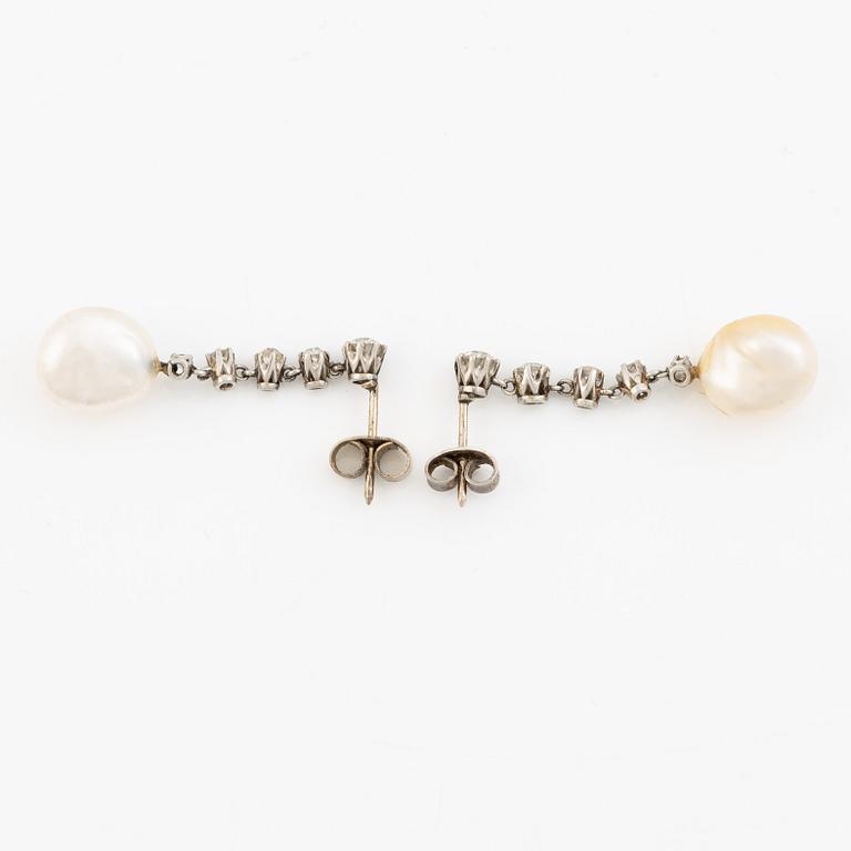A pair of  earrings in white gold with pearls and old-cut diamonds.