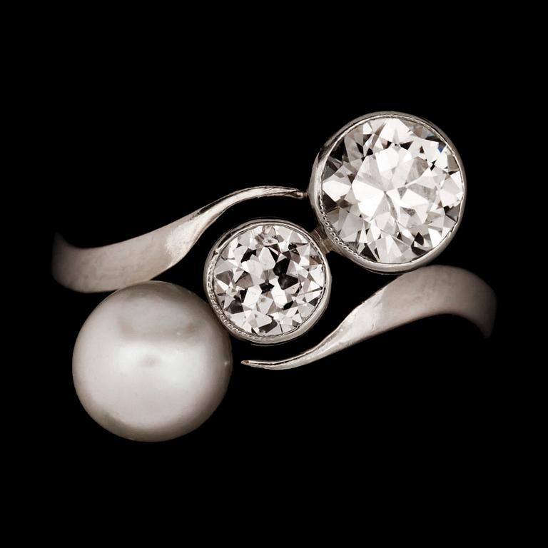 An old cut diamond and possibly natural blister pearl ring. Diamonds total carat weight circa 0.90ct.