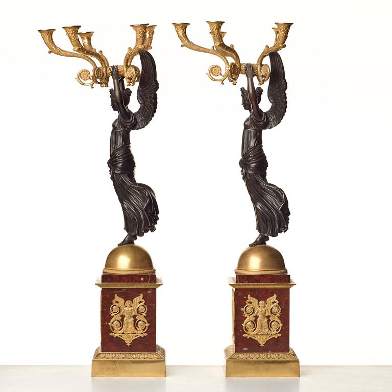 A pair of important five light Empire candelabra.