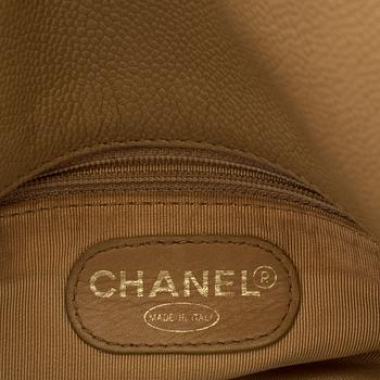 a CHANEL caviar leather bag.