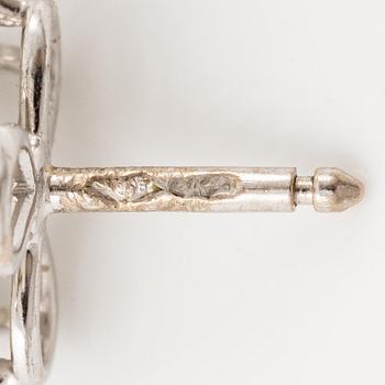 A pair of Cartier earrings in 18K white gold with six heart-shaped brilliant-cut diamonds.