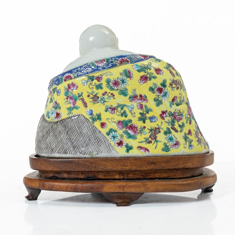 A Chinese famille rose porcelain figure of a Budai, around 1900.