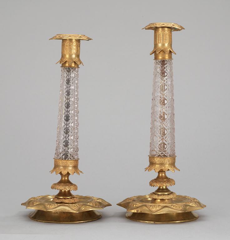 Two similar Russian 1830's gilt brass and glass candlesticks.