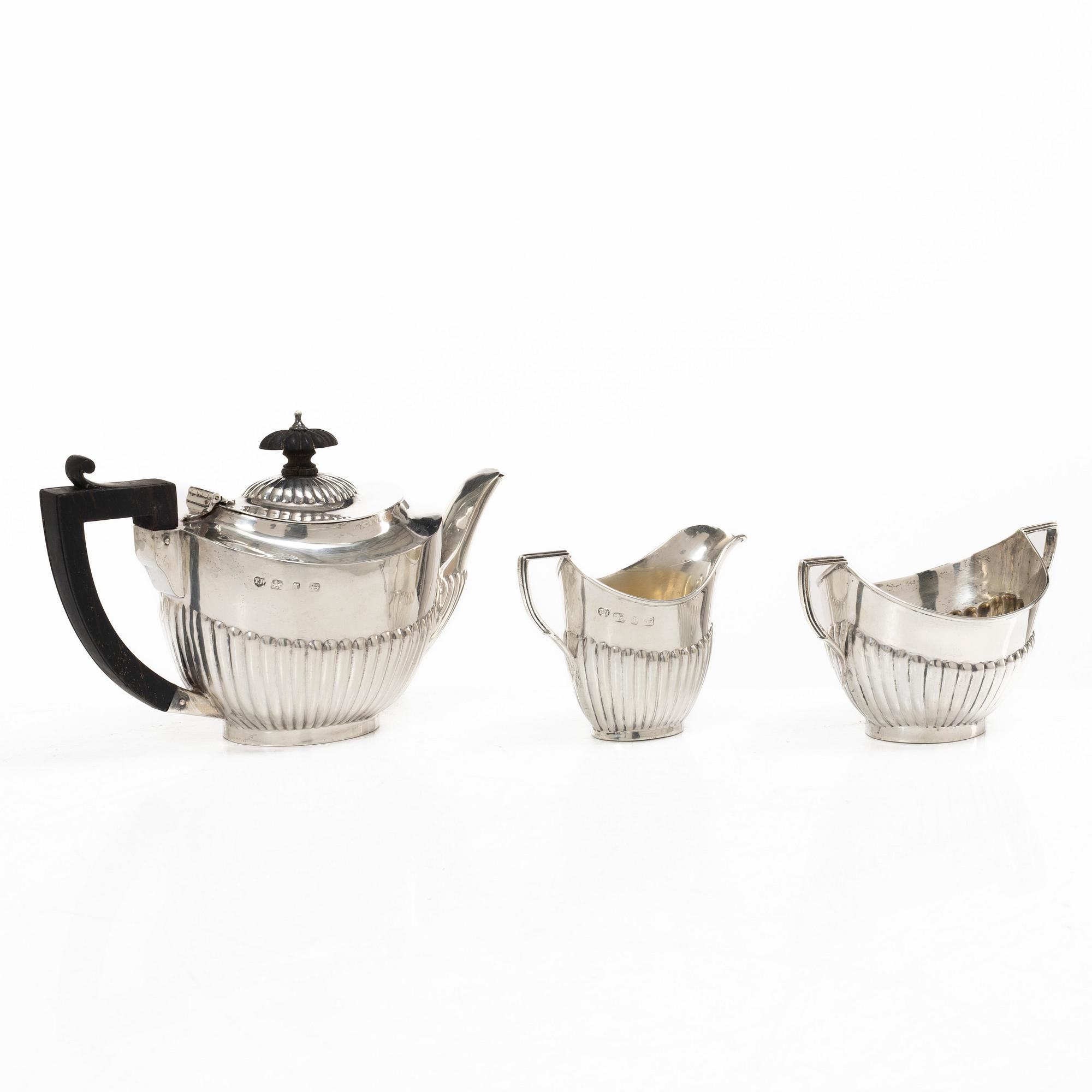 Thomas Hayes, a silver teapot, cream jug and sugar bowl, Birmingham 1897.