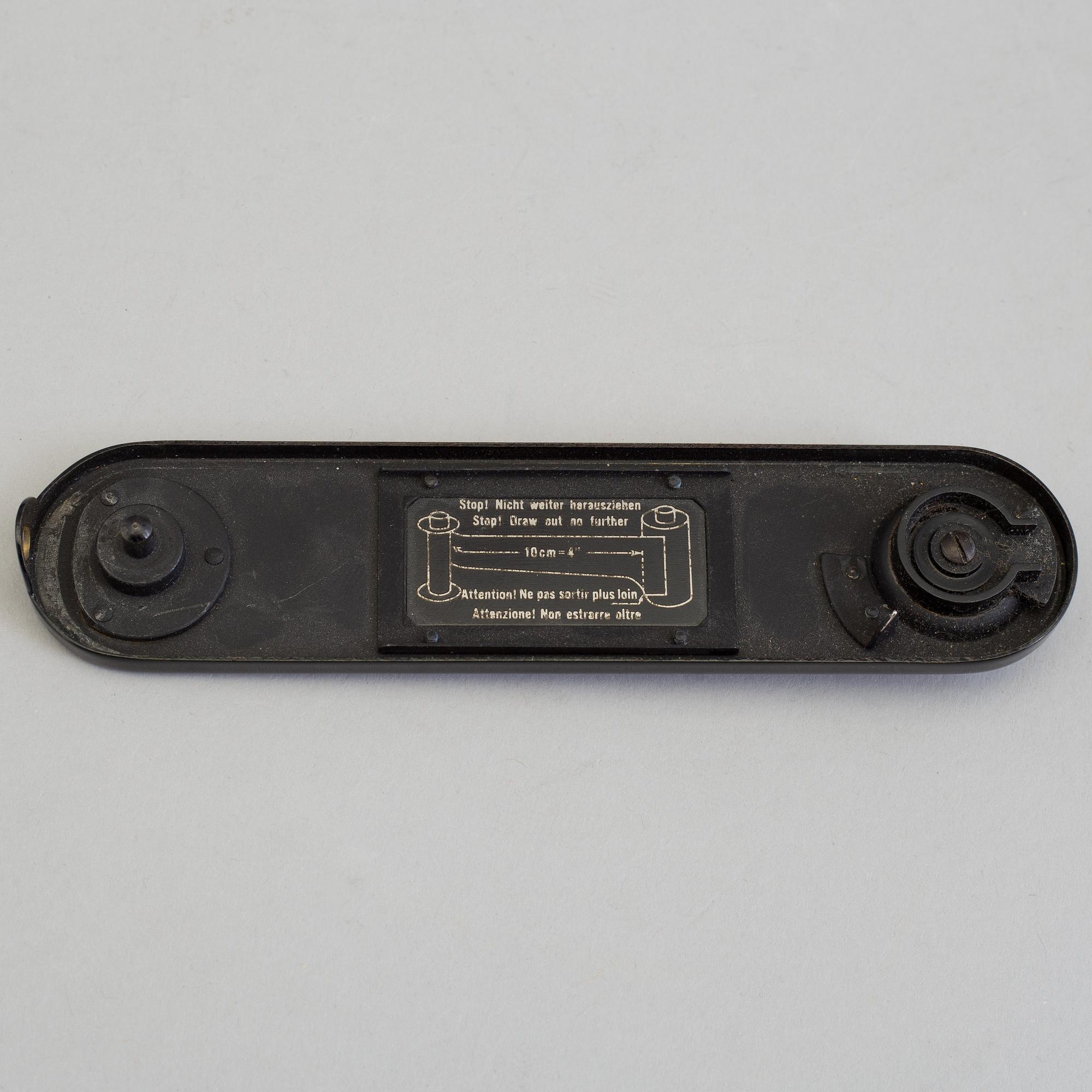 A early 1930s black body Leica no 123864 with a chrome Hektor 1:2,5 F=5 cm lens. With table stand.