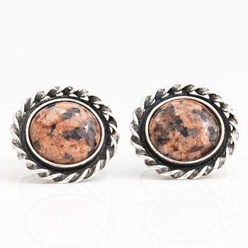 A set of three pairs of silver cufflinks with hematite, tigers eye and granite. Turun Hopea and Osvald Mättö.