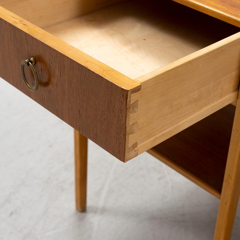 A pair of teak veneered bedside table, mid 20th Century.