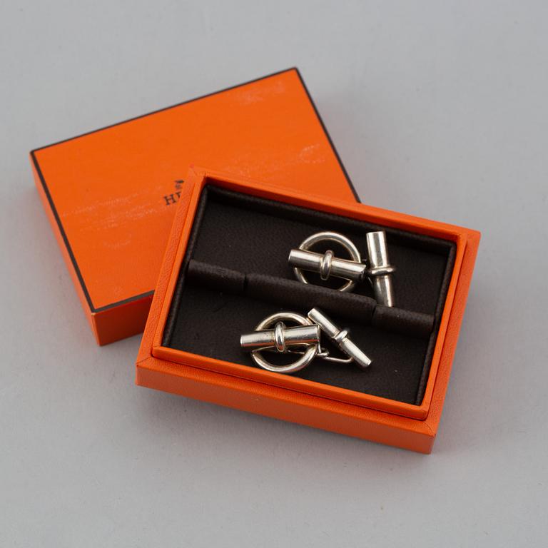 HERMÈS, a pair of silver cuff links.