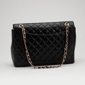 CHANEL, a quilted black leather shoulder bag, "Flap bag maxi".