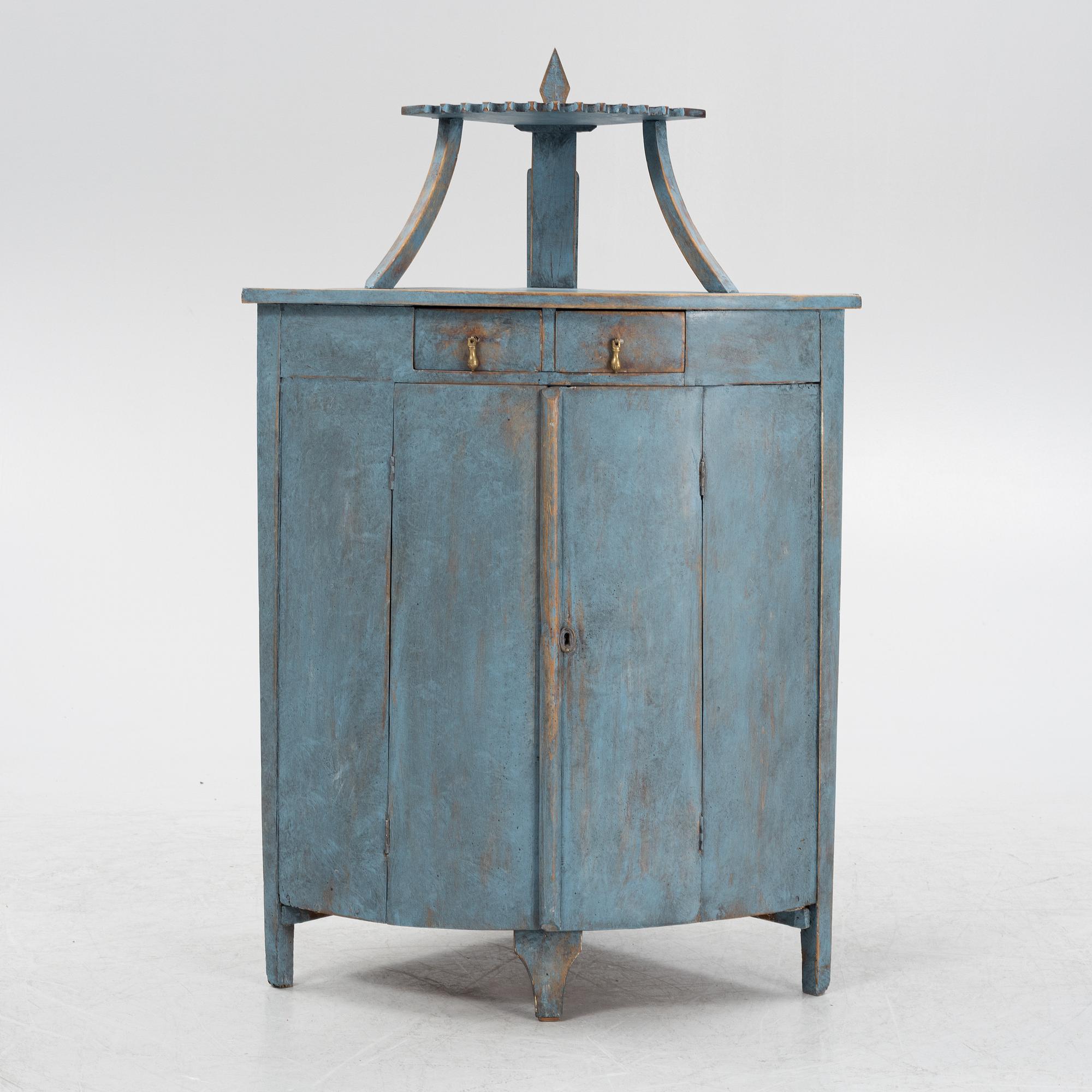 A painted corner cabinet, late 19th century.