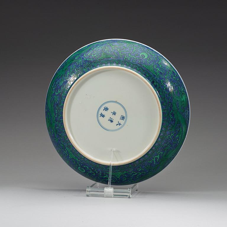 A large green enamelled blue and white dragon dish, probably late Qing dynasty with Kangxi's six character mark.