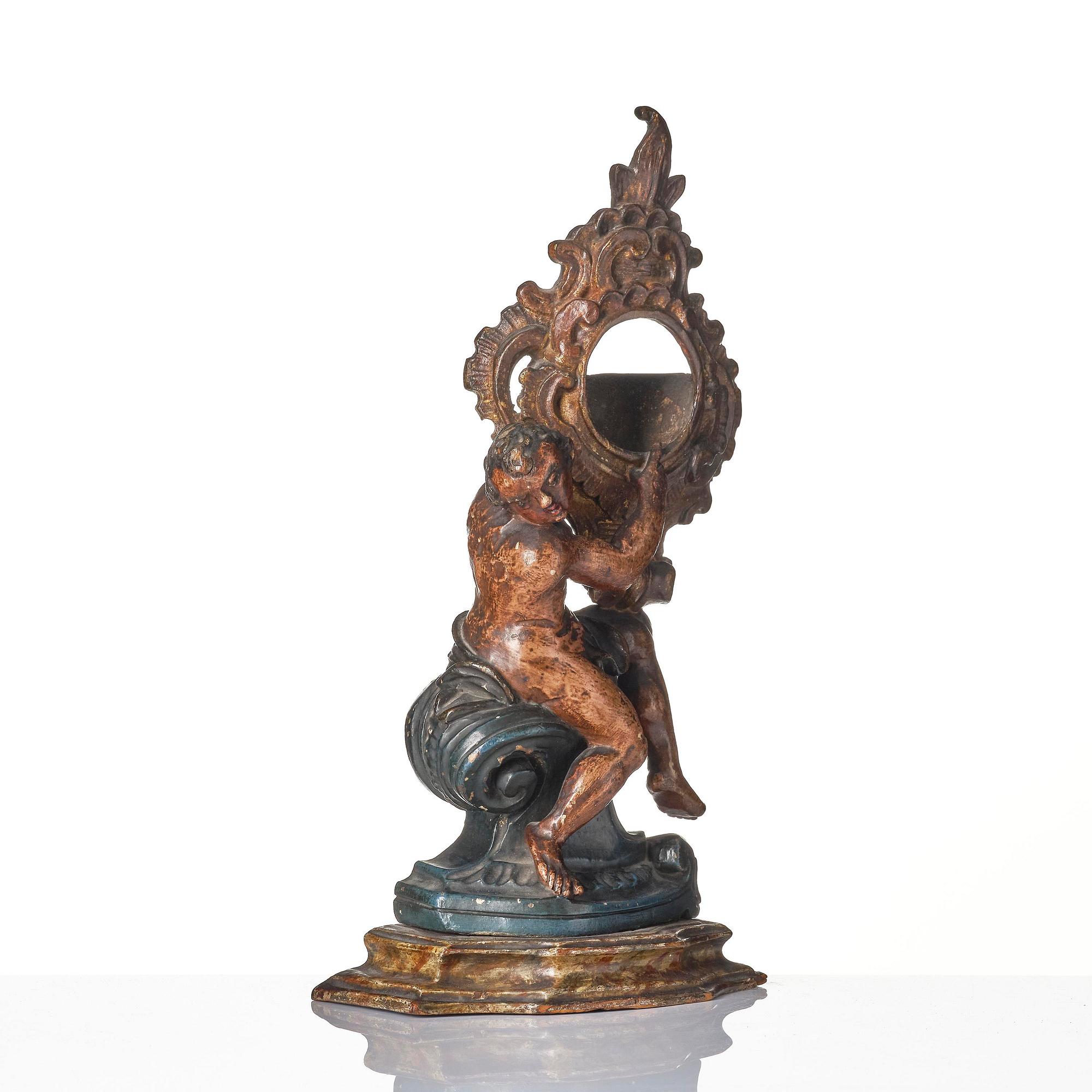 A Northern-European rococo carved pocket-watch holder, later part 18th century.