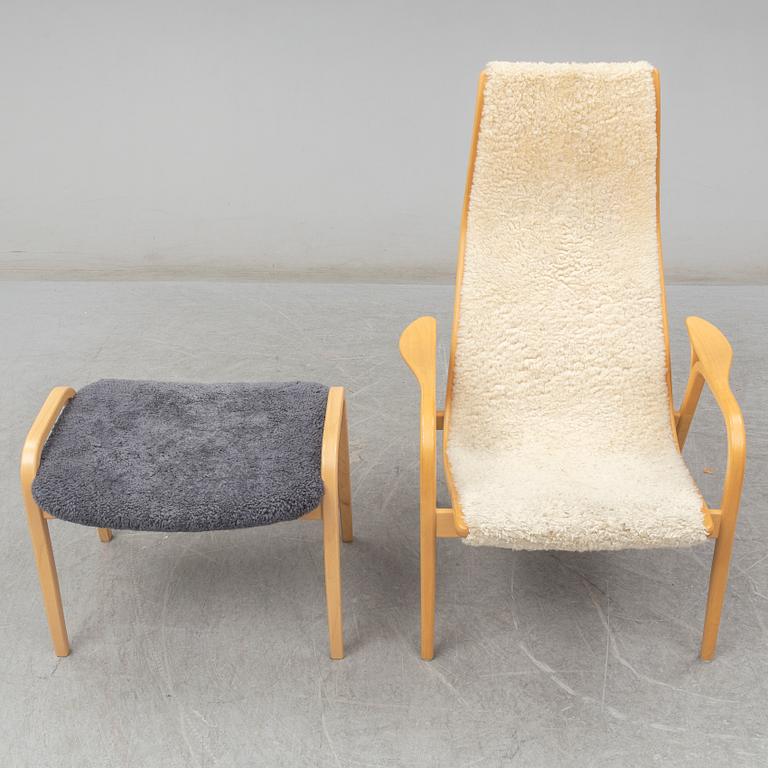 a 'Lamino' armchair with a stool by Yngve Ekström for Swedese.