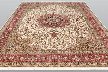 A carpet, Tabriz part silk, so called 50 Raj, cm 400 x 300 cm.