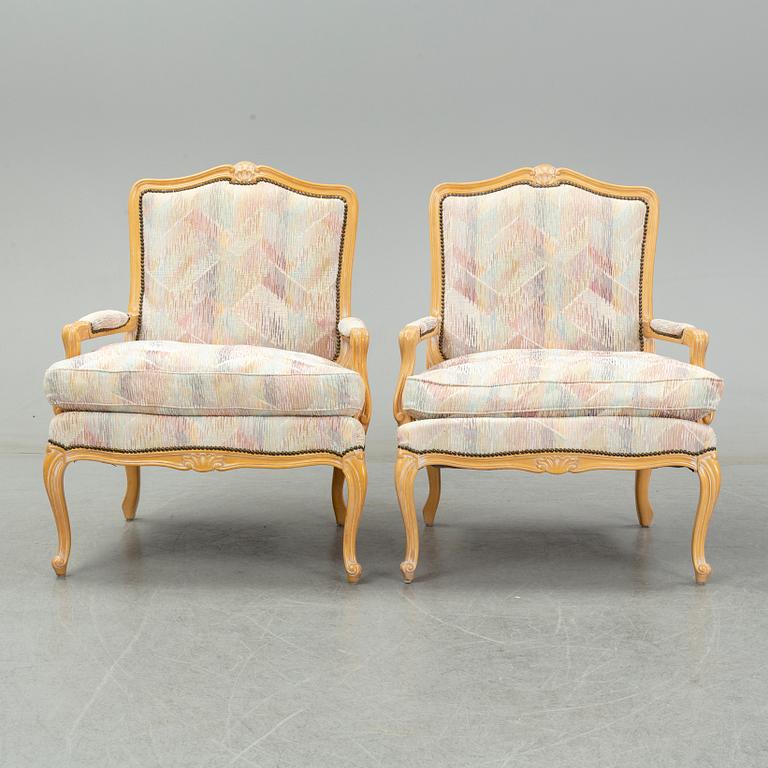 An end of the 20th Century pair of rococo style armchairs.