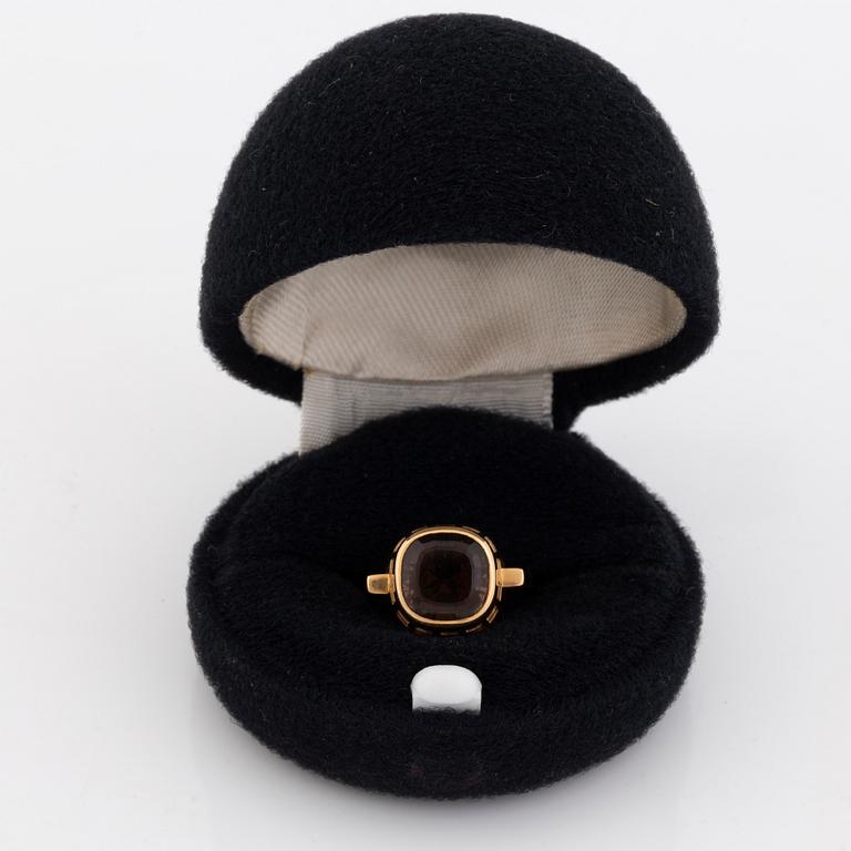 An 18K gold and smoke quartz Sigurd Persson ring.