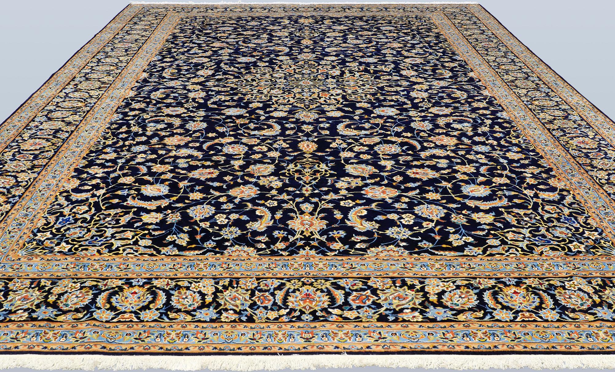 A Keshan carpet, signed, approx. 600 x 400 cm.