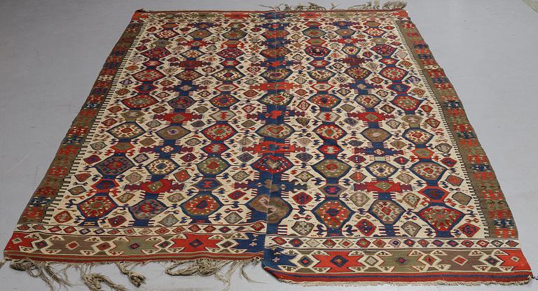 A carpet, a kilim, an antique Anatolian, ca 310-326 x 183,5-192 cm.