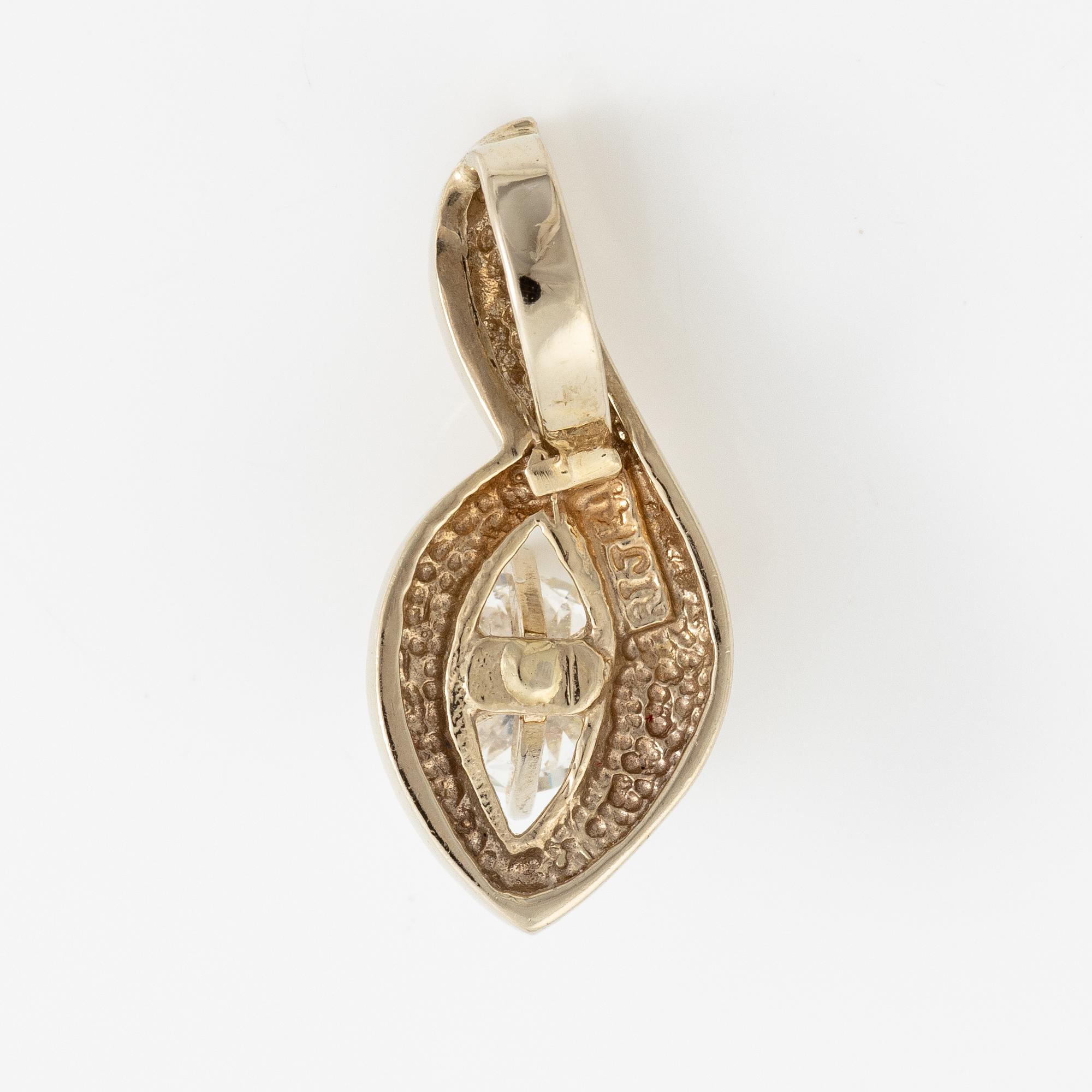 14K white gold solitaire diamond pendant.