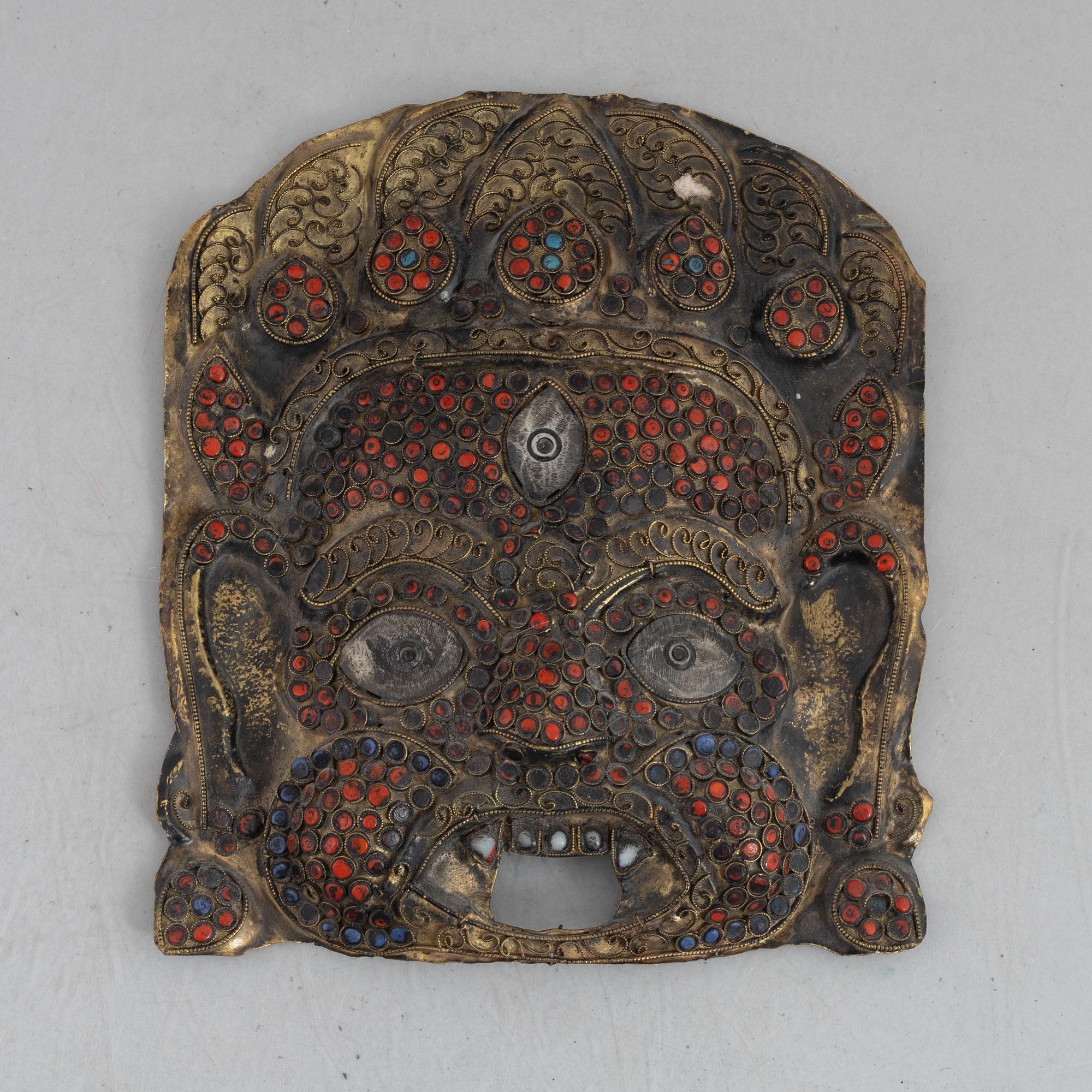 A stone inlay mask, Nepal, early 20th century.