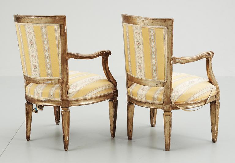 Two 18th century armchairs, probably Italian .