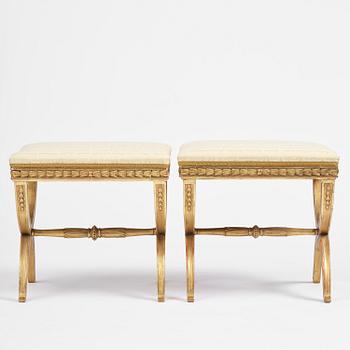 A pair of late Gustavian giltwood stools, Stockholm, late 18th century.