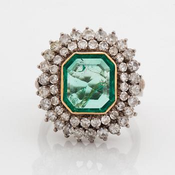 Emerald-cut emerald and eight-cut diamond ring.