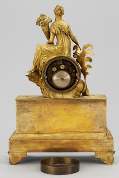 An Empire mantel clock by Becher.