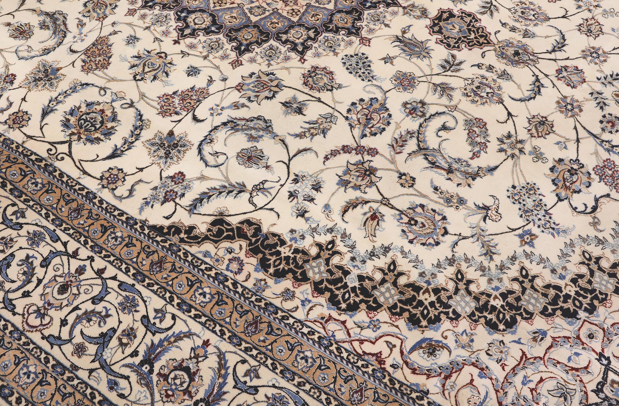A Nain part silk carpet, 407 x 304 cm.