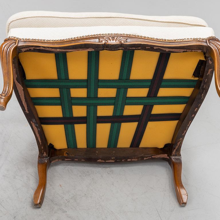 A pair of Rococo style armchairs, later part of the 20th century.