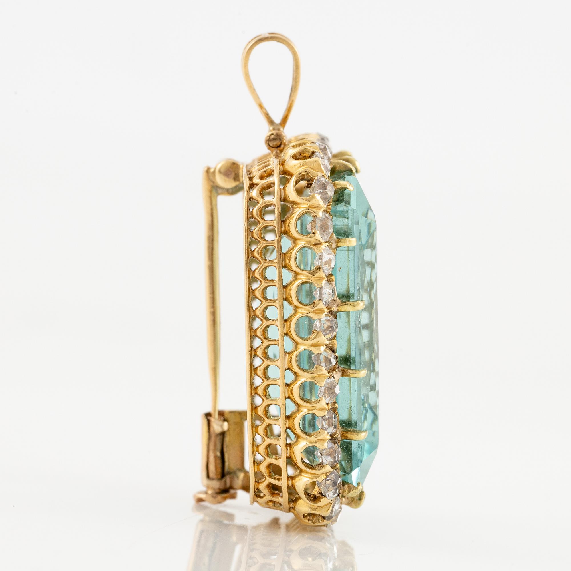 A pendant/brooch in 18K gold with a step-cut aquamarine and old-cut diamonds.