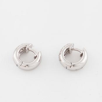 A pair of brilliant cut diamond earrings..