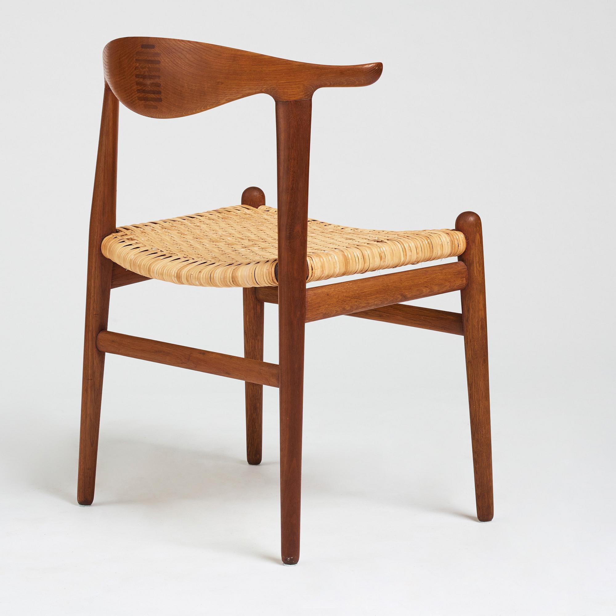 Hans J. Wegner, a teak, oak and cane "Cowhorn chair", JH 505, Johannes Hansen, Denmark 1950-60's.