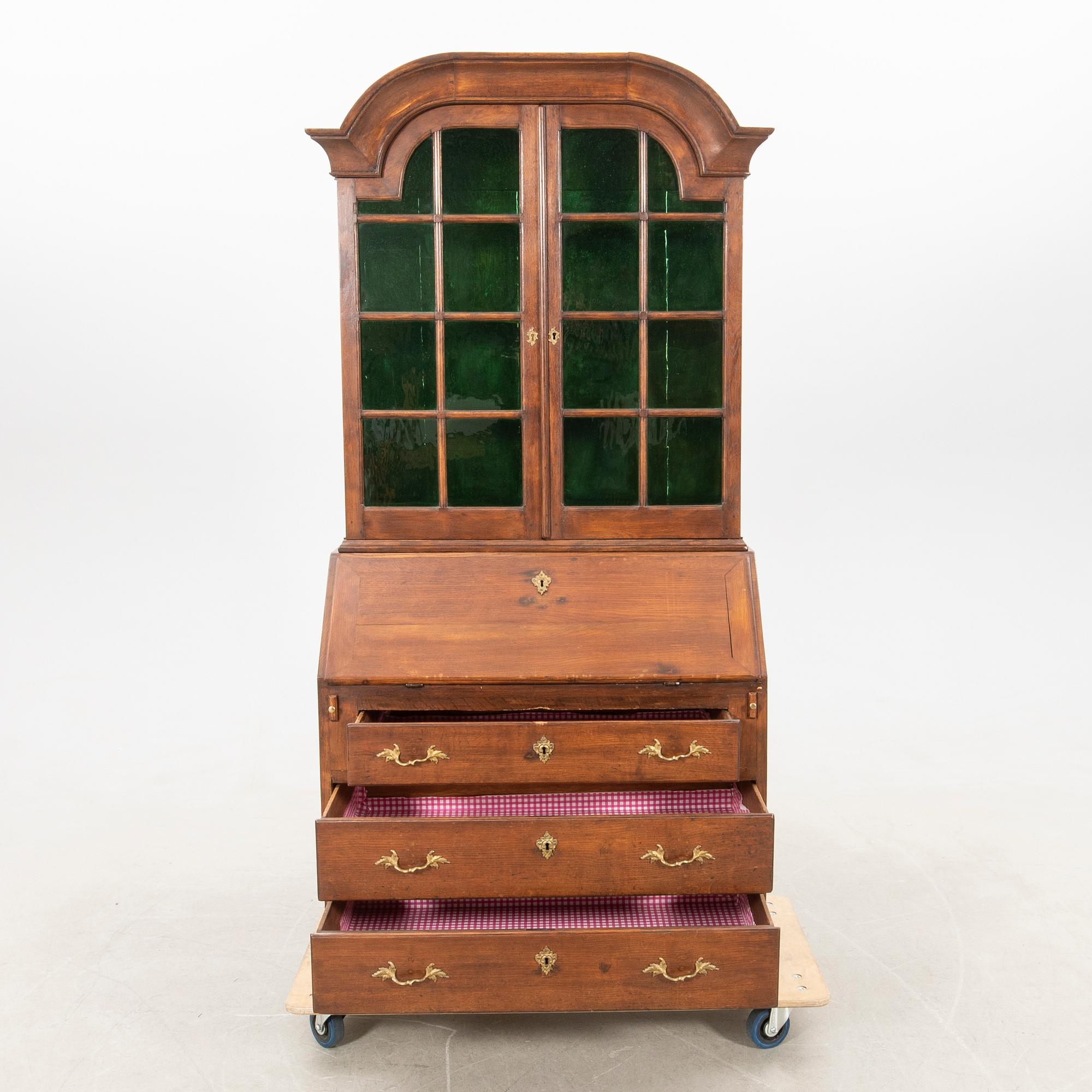 Slant-front secretary with a glazed section, 18th century.