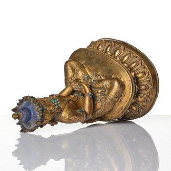 A Tibetan or Nepalese Gilt-Copper Alloy Figure of Sarvavid Vairocana, 15th century.