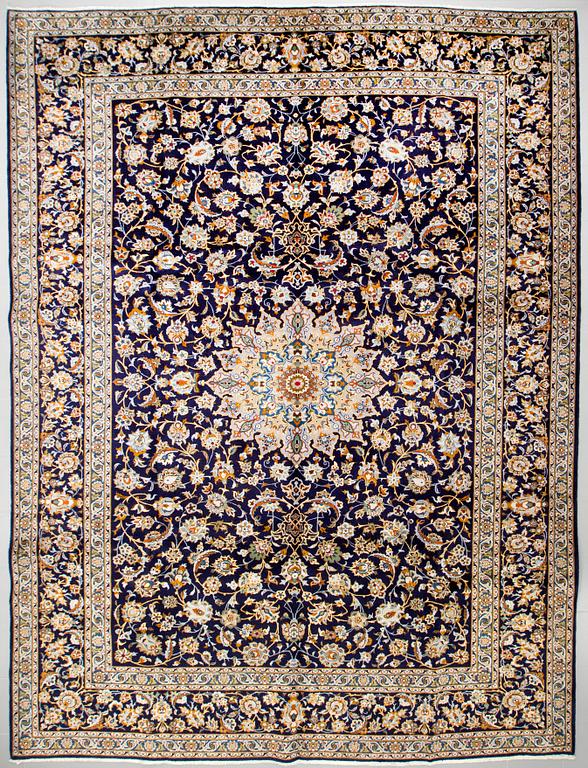 A Keshan rug, signed, 405 x 301 cm.