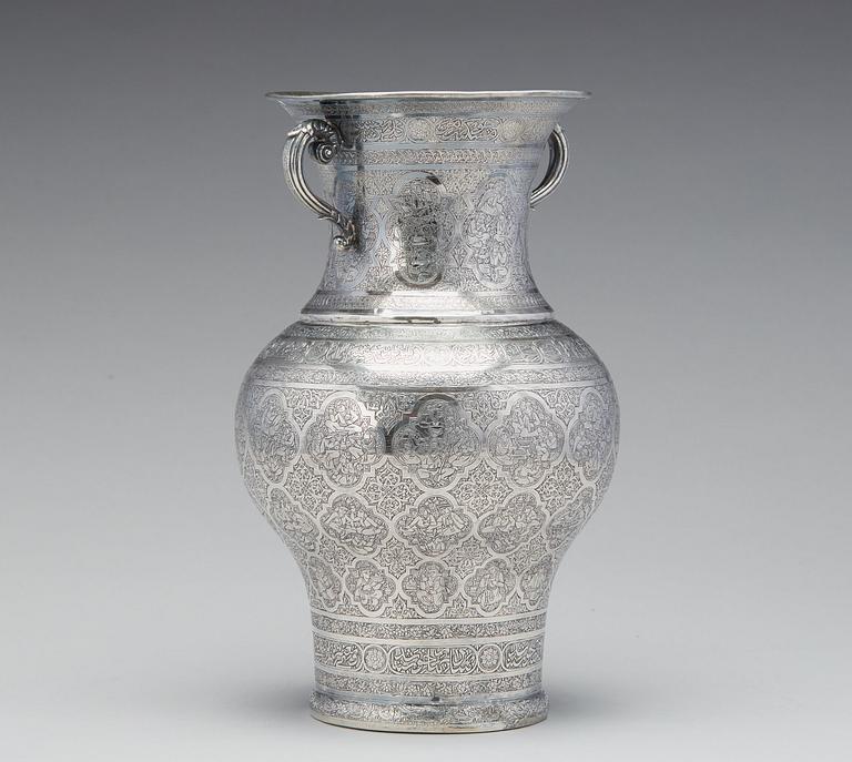 A  persian silver two handled vase from the late Qajardynasty.