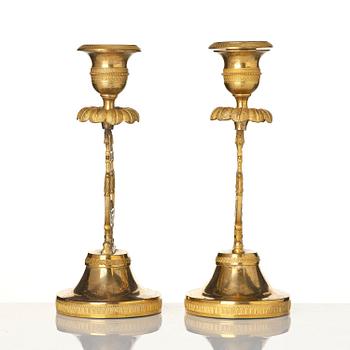A pair of Swedish Empire ormula candlesticks.