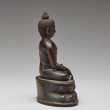 A copper alloy figure of Buddha Shakyamundi, Tibet, 17th Century.