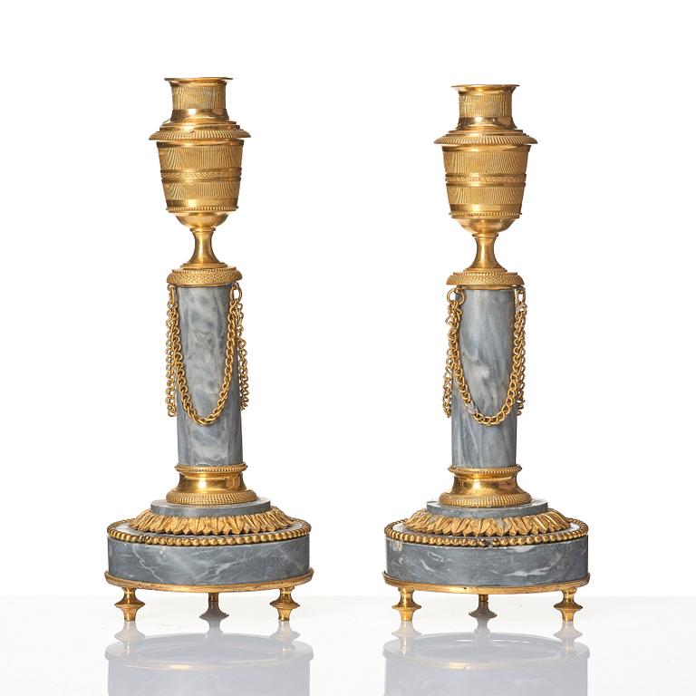 A pair of Louis XVI ormolu and marble cassolettes, late 18th century.