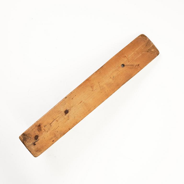 A Swedish folk art carved wringer, dated 1669.