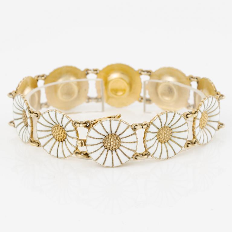 Georg Jensen and A Michelsen "Daisy" a bracelet, a pendant, and a brooch silver gilt and enamel.