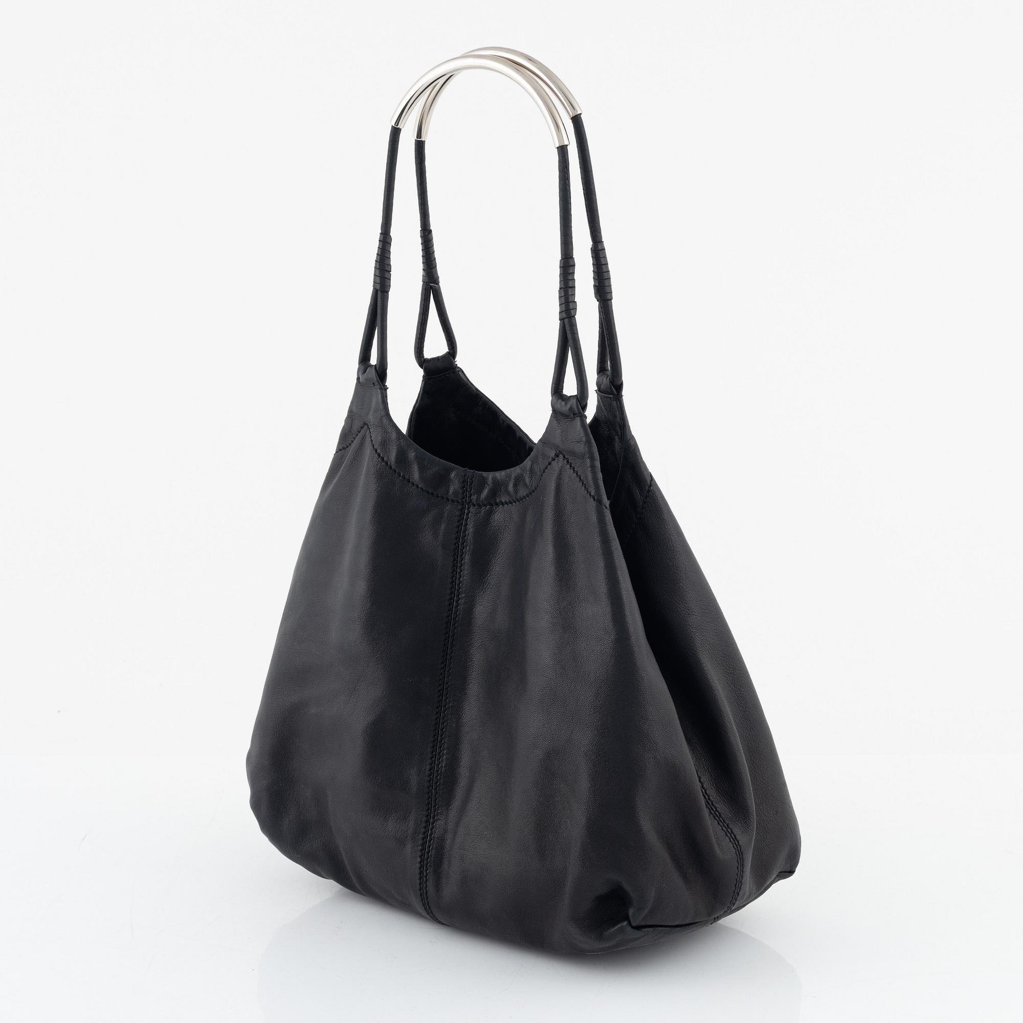 Prada, A black leather bag.