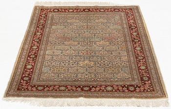 A rug, old, silk Hereke, signed, ca 166,5 x 109 cm.