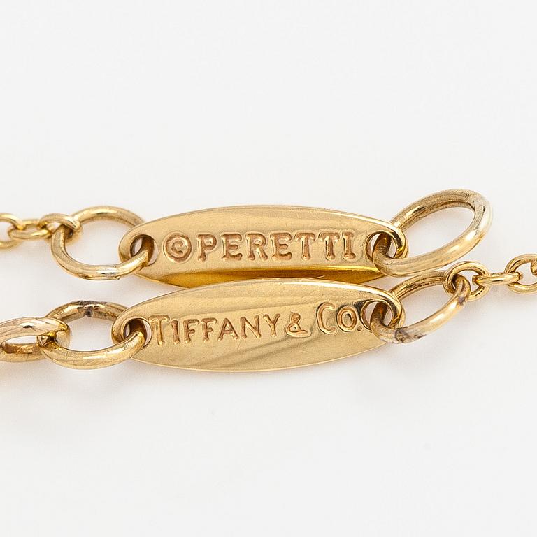 Tiffany & Co, Elsa Peretti, an 18K gold "Teardrop" necklace with a rock crystal pendant.