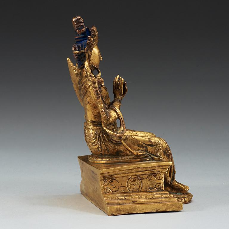 A Sino-Tibetan gilt bronze figure of Maitreya.